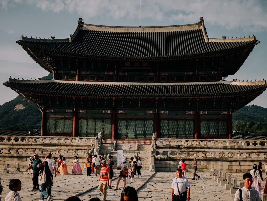 People visiting a traditional korean palace building
