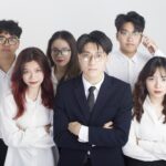 a group of people standing next to each other